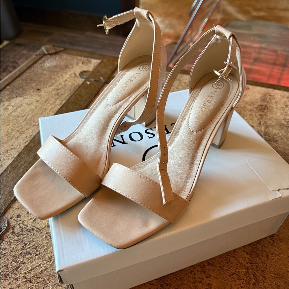 Nude block heeled sandal.